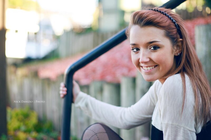 smiling woman on stairs