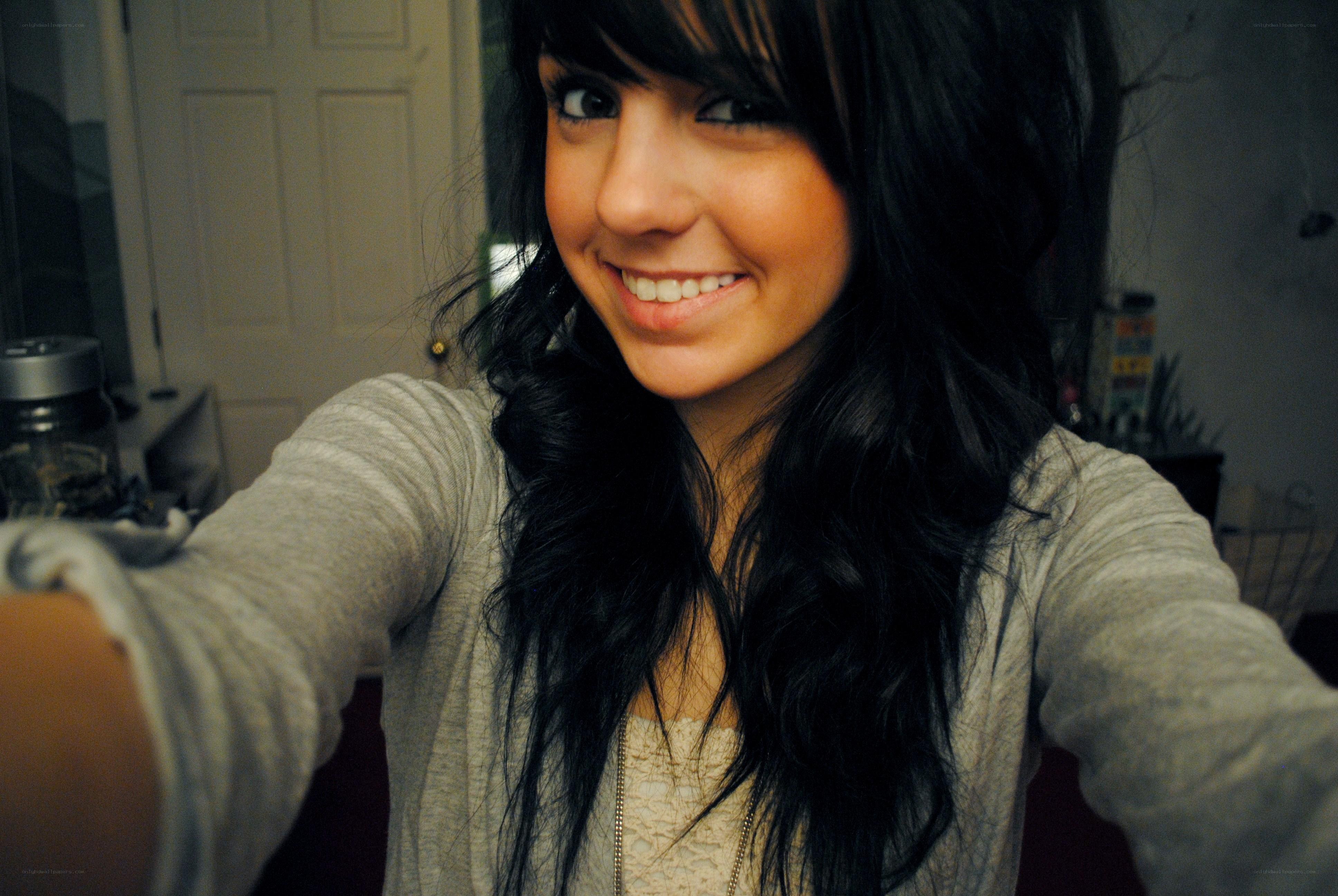 smiling woman taking selfie