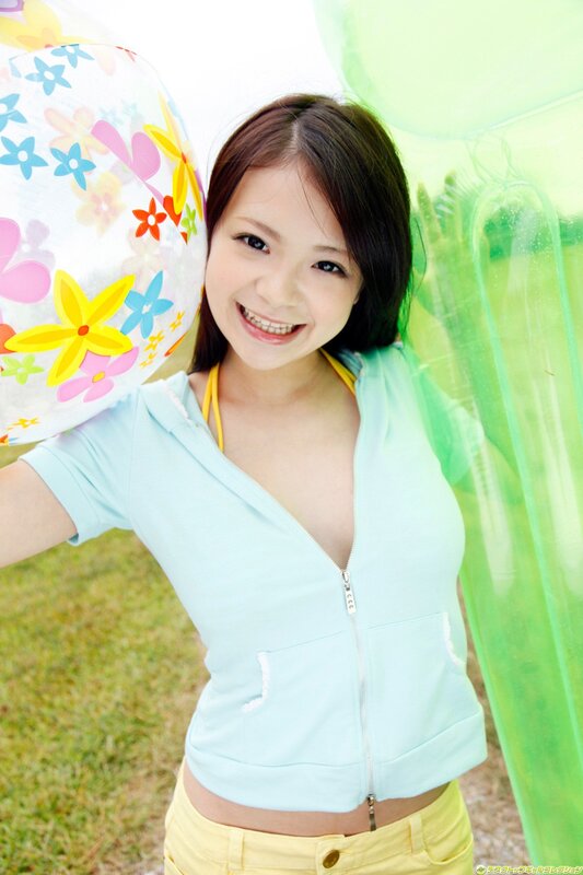 Smiling woman with beach ball