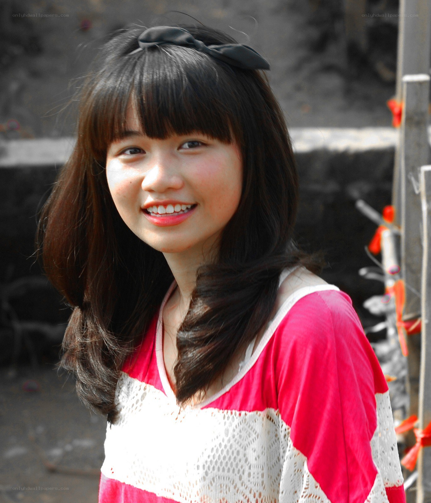 smiling woman with bow
