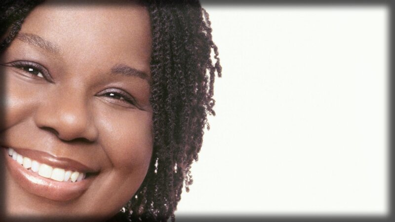 smiling woman with braided hair