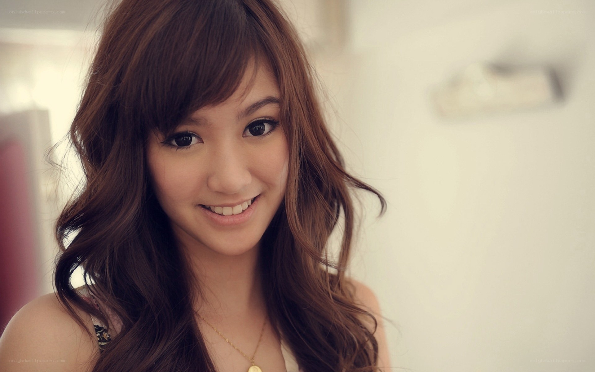 smiling woman with brown hair