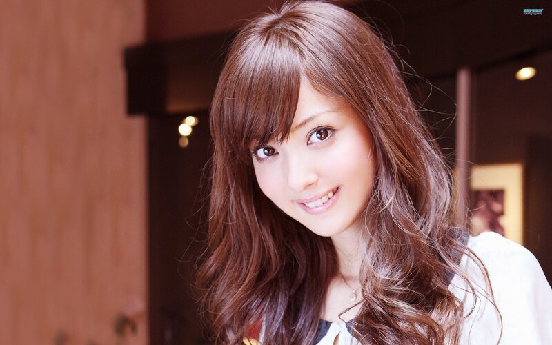 smiling woman with brown hair
