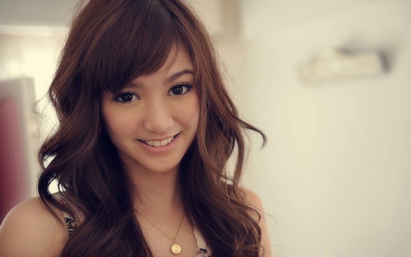 smiling woman with brown hair