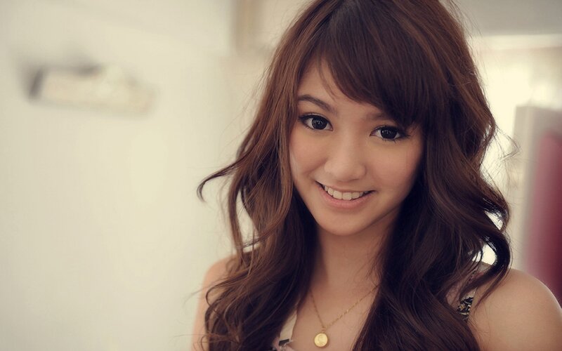 smiling woman with brown hair