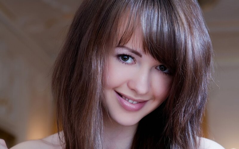 smiling woman with brown hair