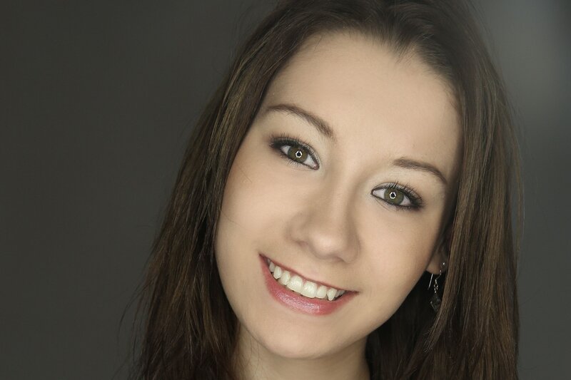 smiling woman with brown hair