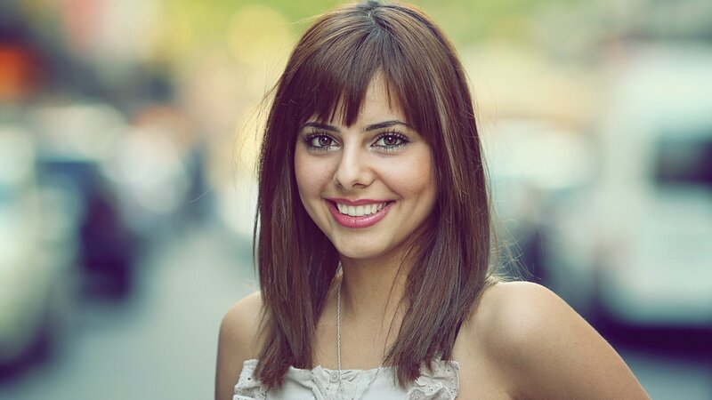 smiling woman with brown hair