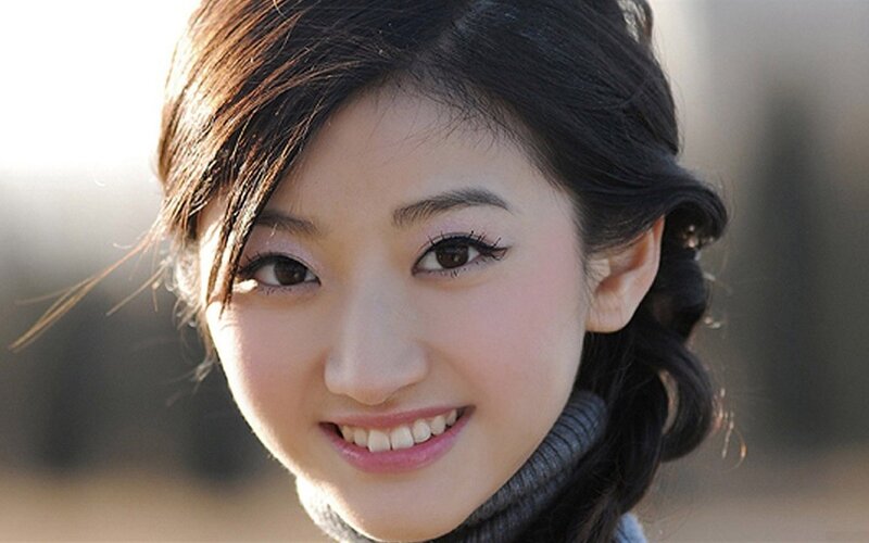 smiling woman with dark hair