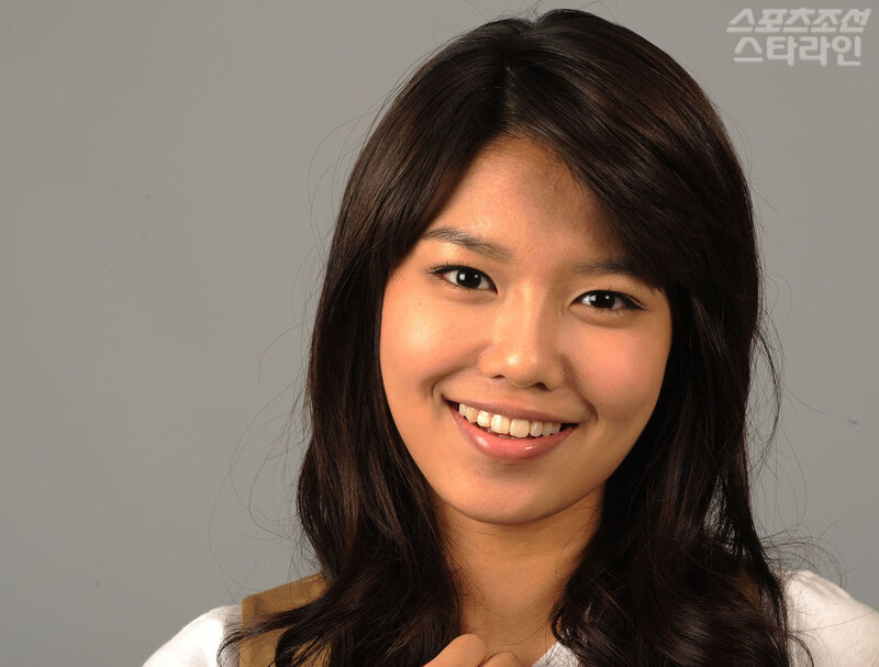 smiling woman with dark hair
