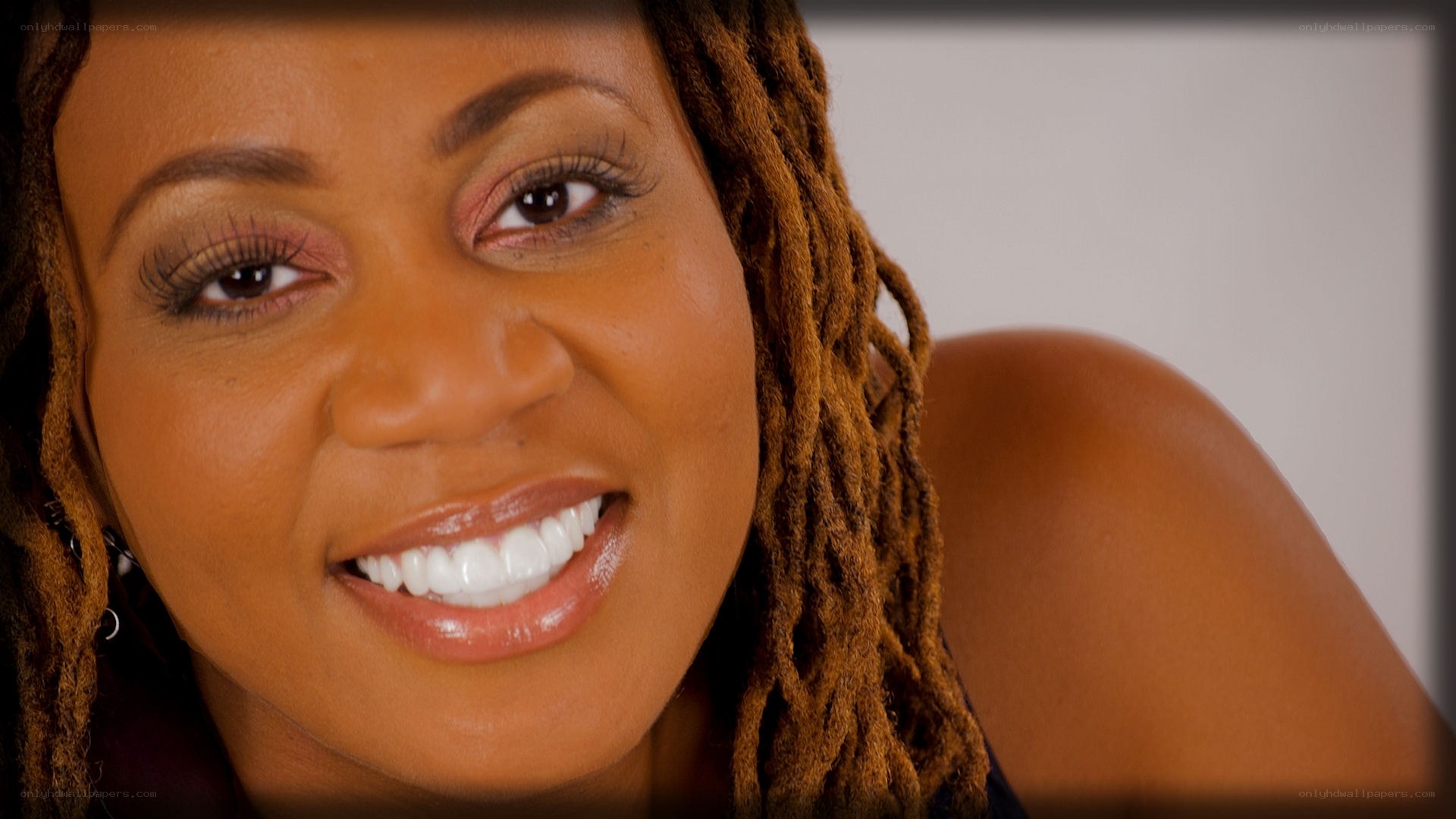 smiling woman with dreadlocks