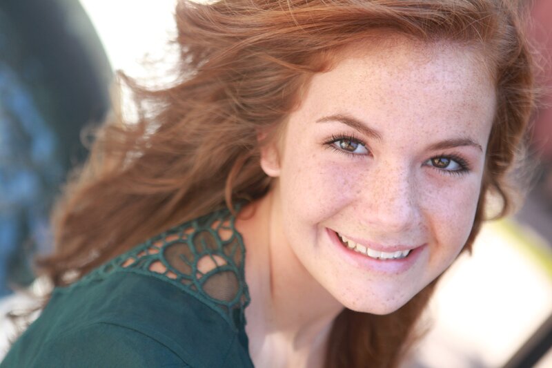 smiling woman with red hair