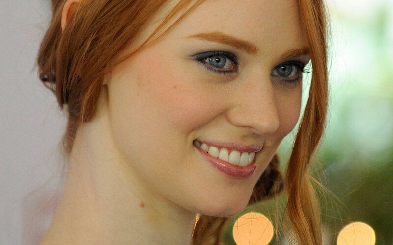smiling woman with red hair