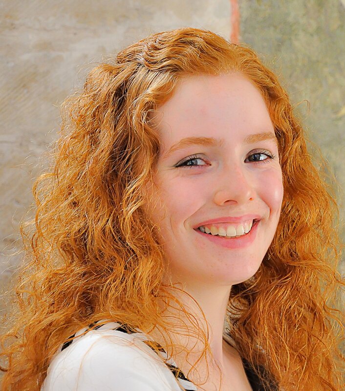 smiling woman with red hair