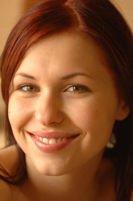 smiling woman with red hair