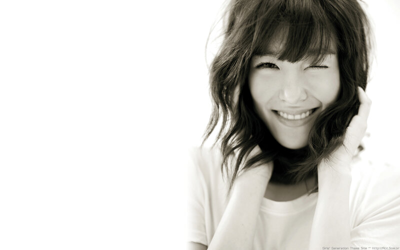 smiling woman with wavy hair