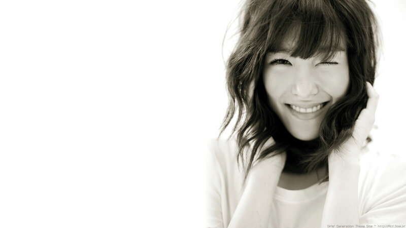 smiling woman with wavy hair