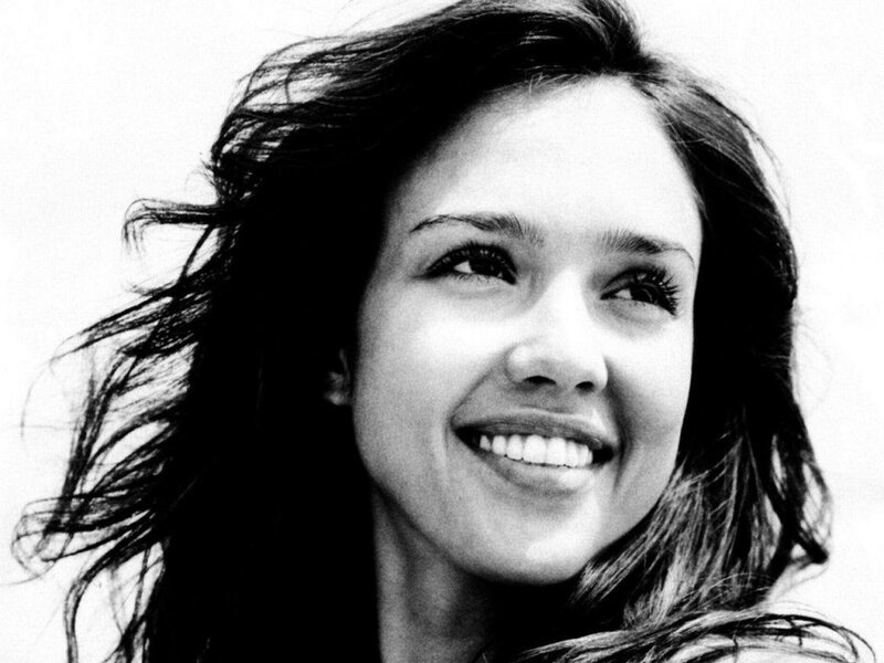 smiling woman with wind-blown hair