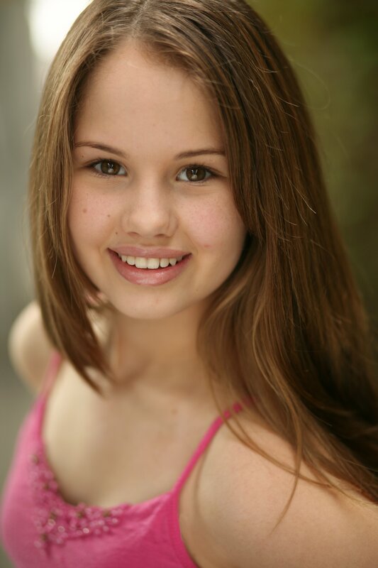 smiling young girl in pink top