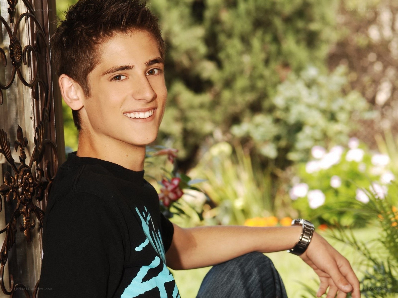 smiling young man in garden