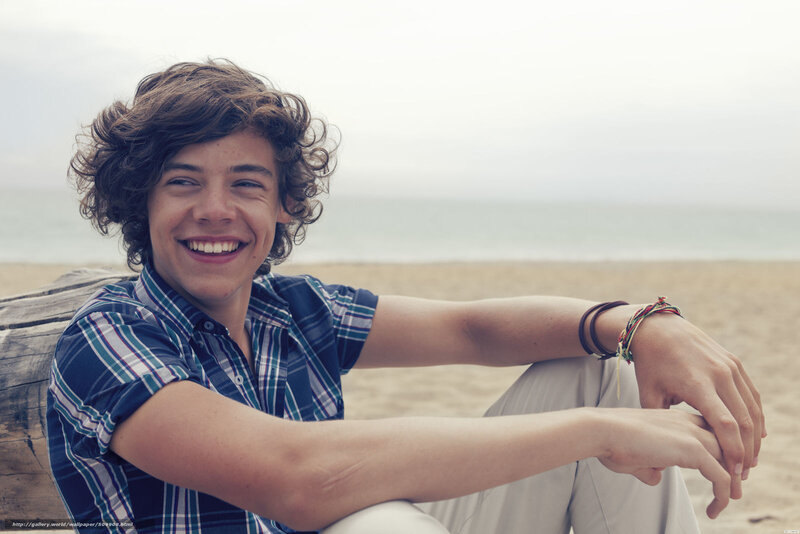 smiling young man on beach