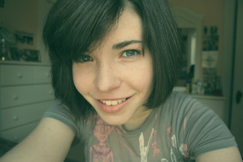smiling young woman in bedroom