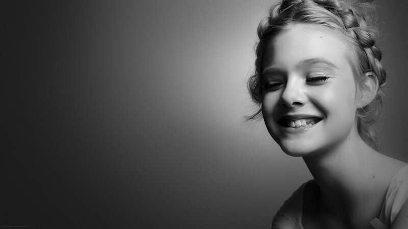 smiling young woman in black and white