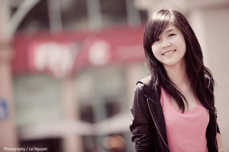 smiling young woman in pink top