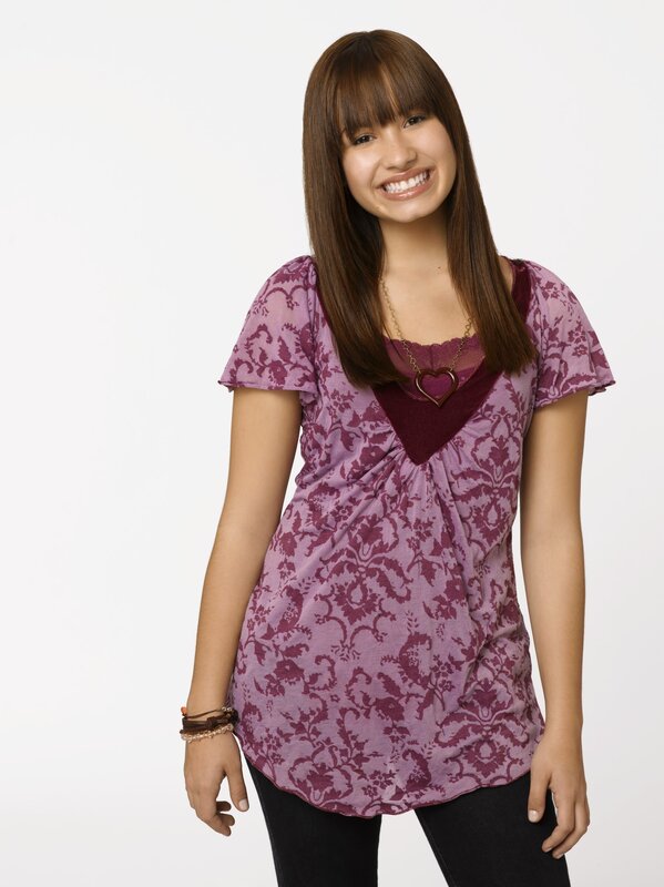 Smiling young woman in purple top