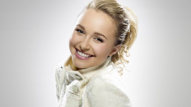 smiling young woman in white coat