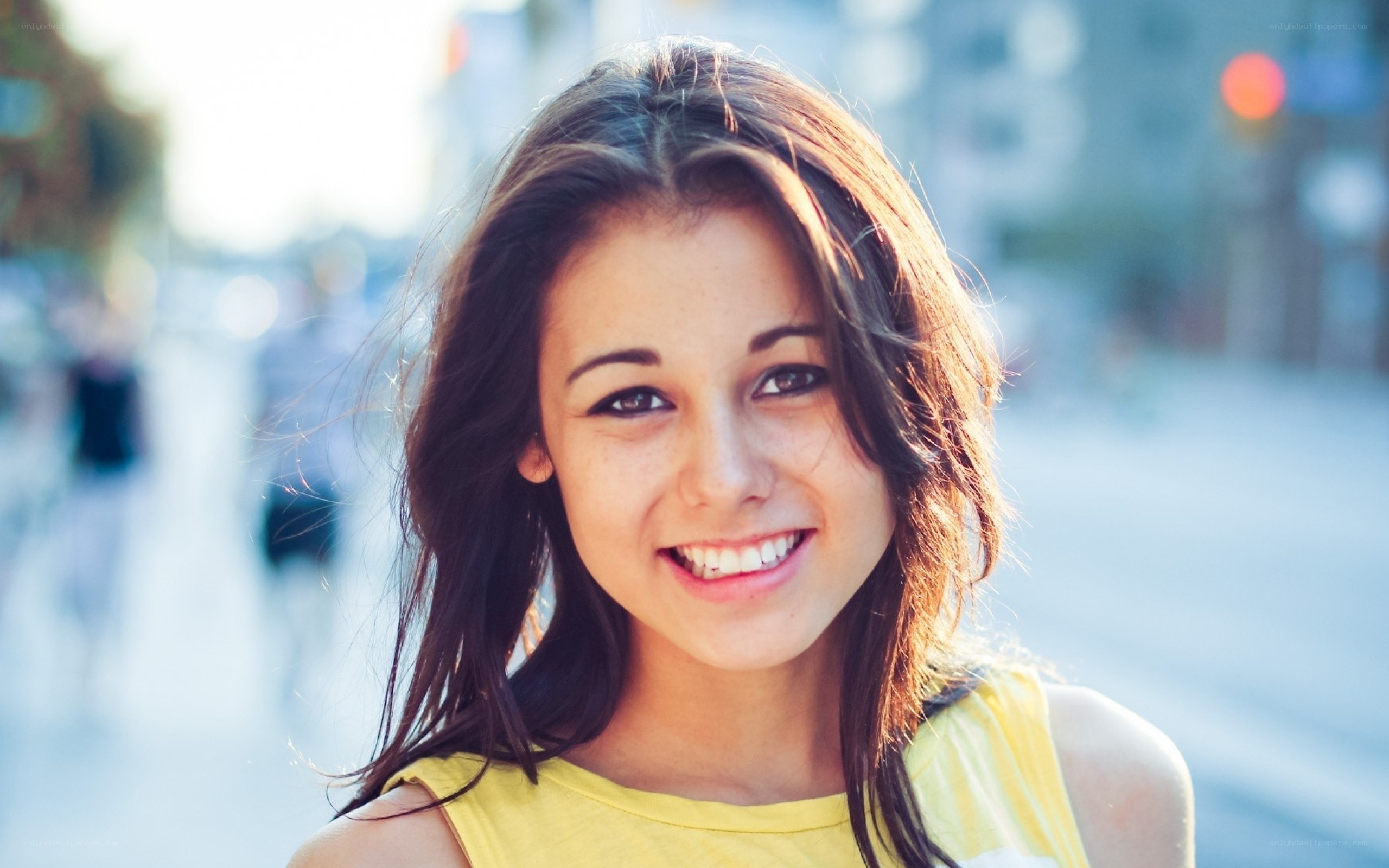 smiling young woman in yellow