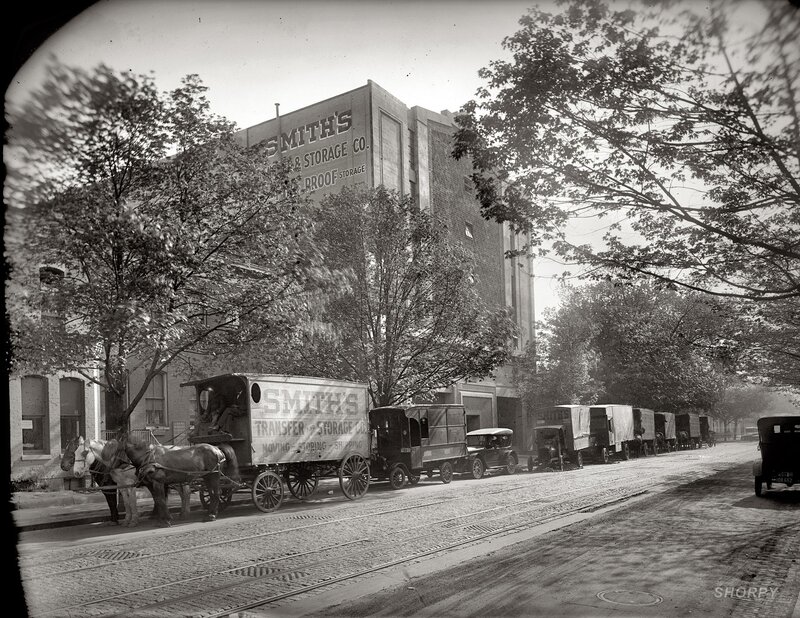 Smith's Moving Trucks on a City Street