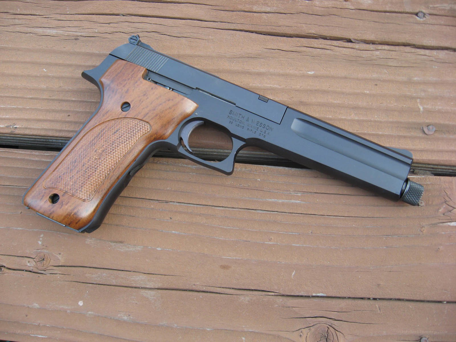 Smith & Wesson pistol on wood