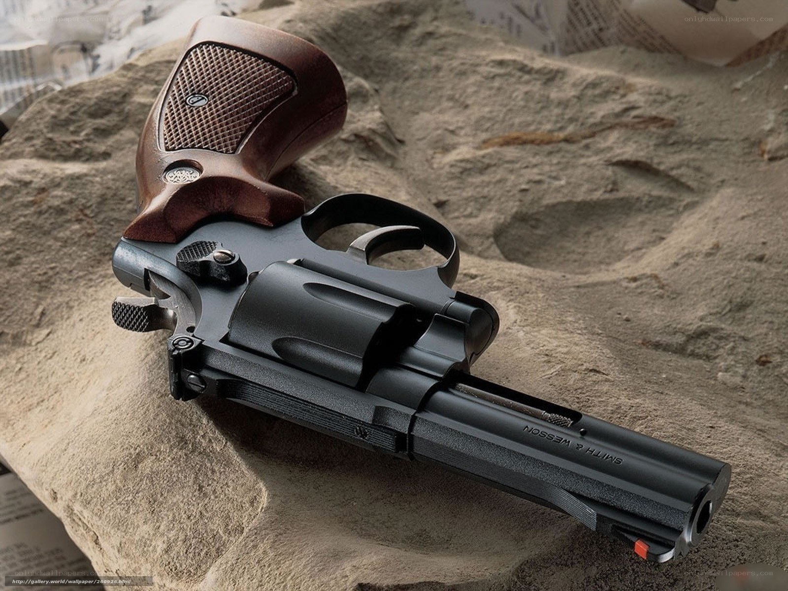 Smith & Wesson revolver on rock