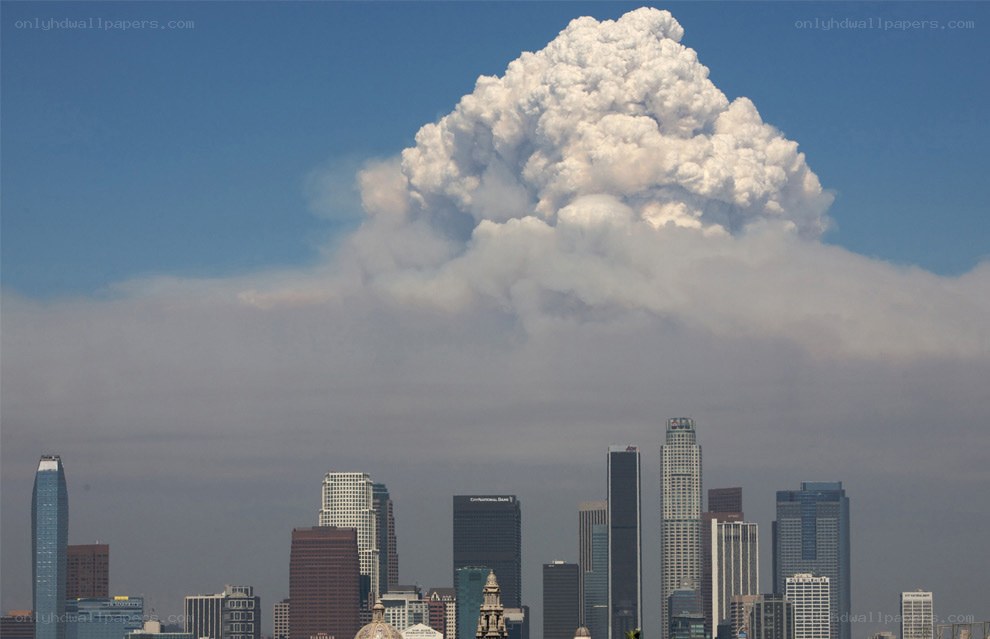 Smoke cloud over city skyline