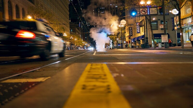 Smoke on city street at night