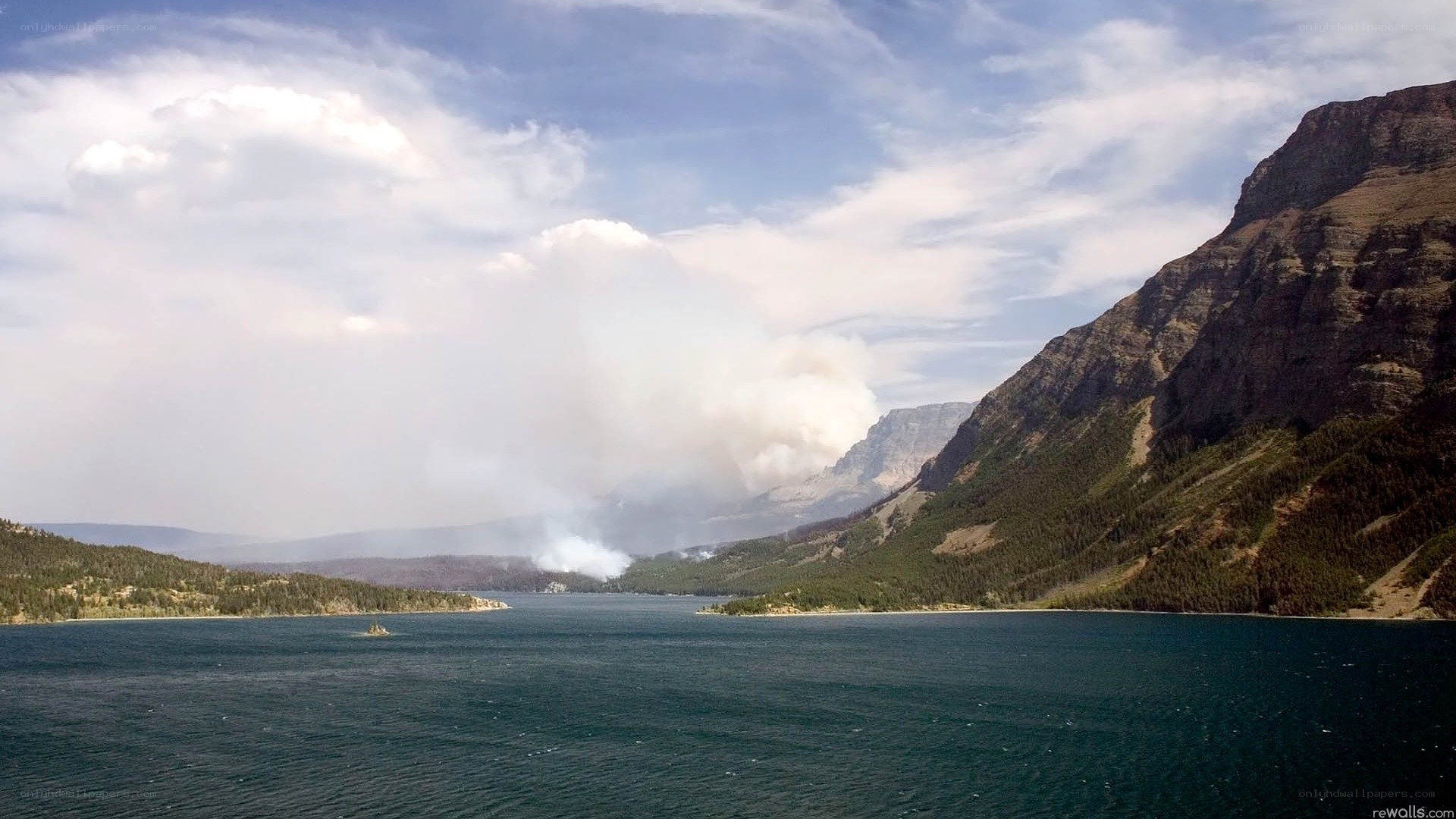 Smoke over a mountain lake
