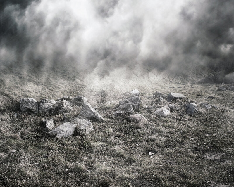 smoke over a rocky field