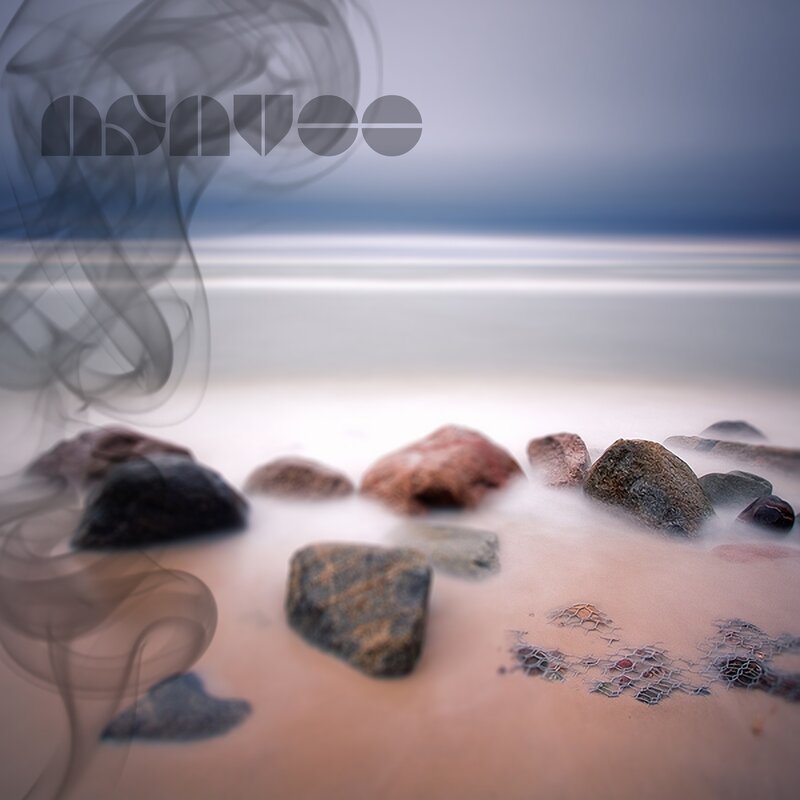 Smoke over beach rocks