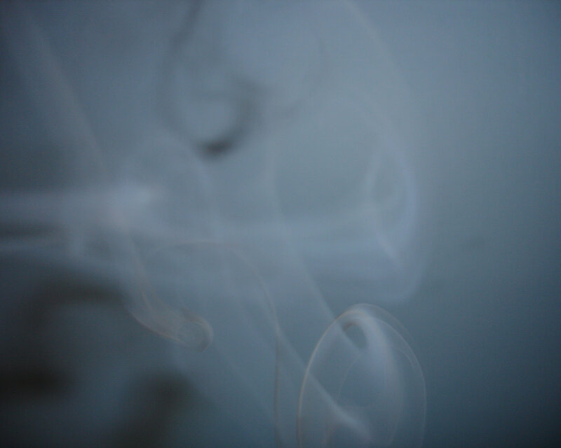 smoke swirls in blue light