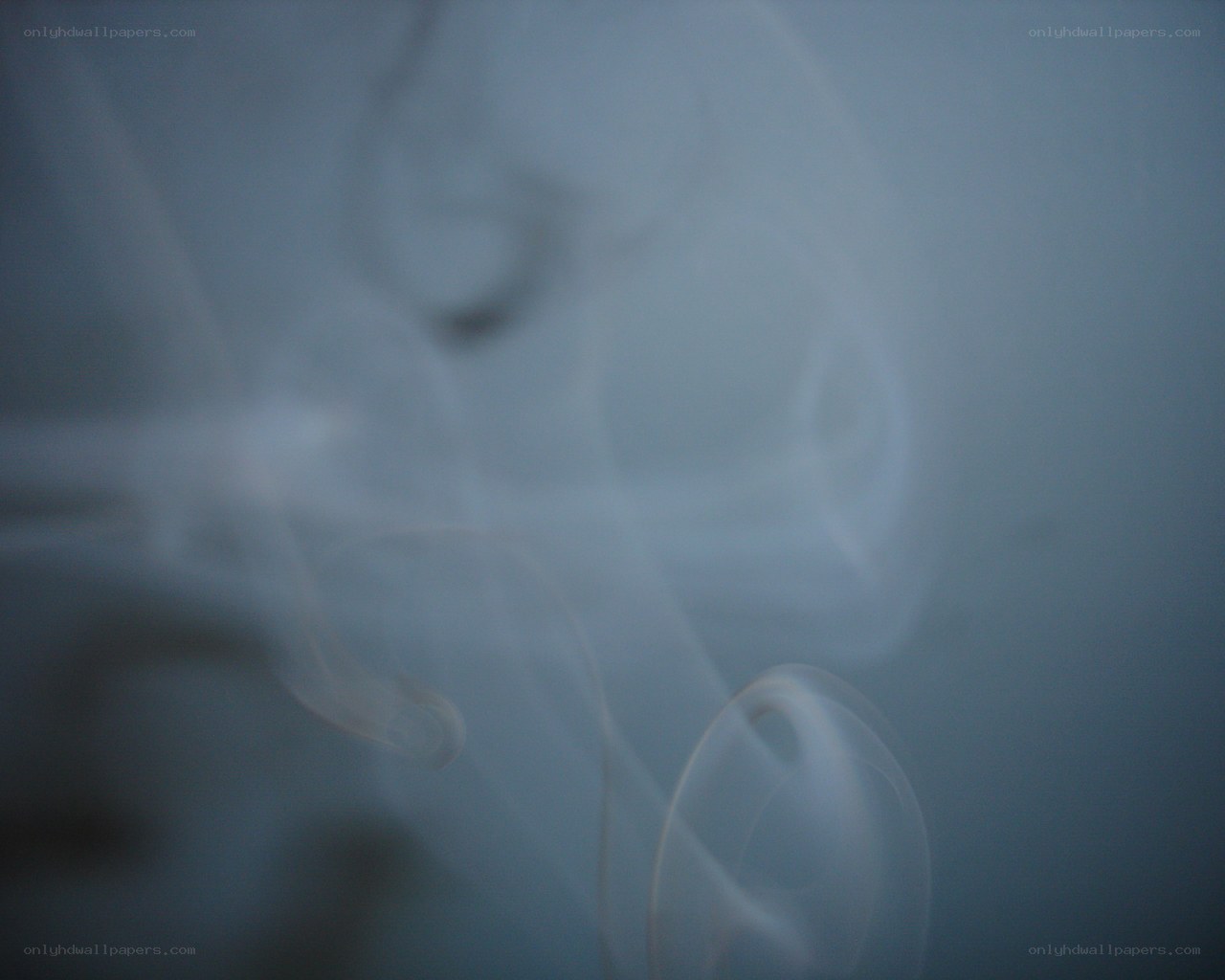 smoke swirls in blue light