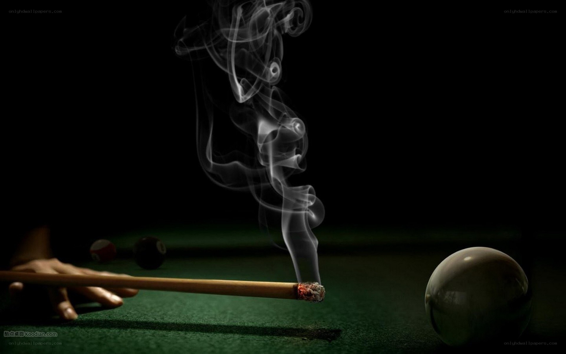 smoking pool cue on green table
