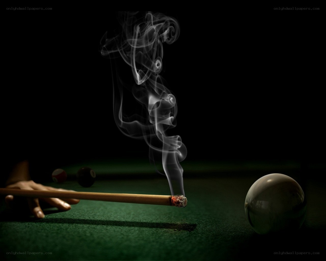 smoking pool cue on green table