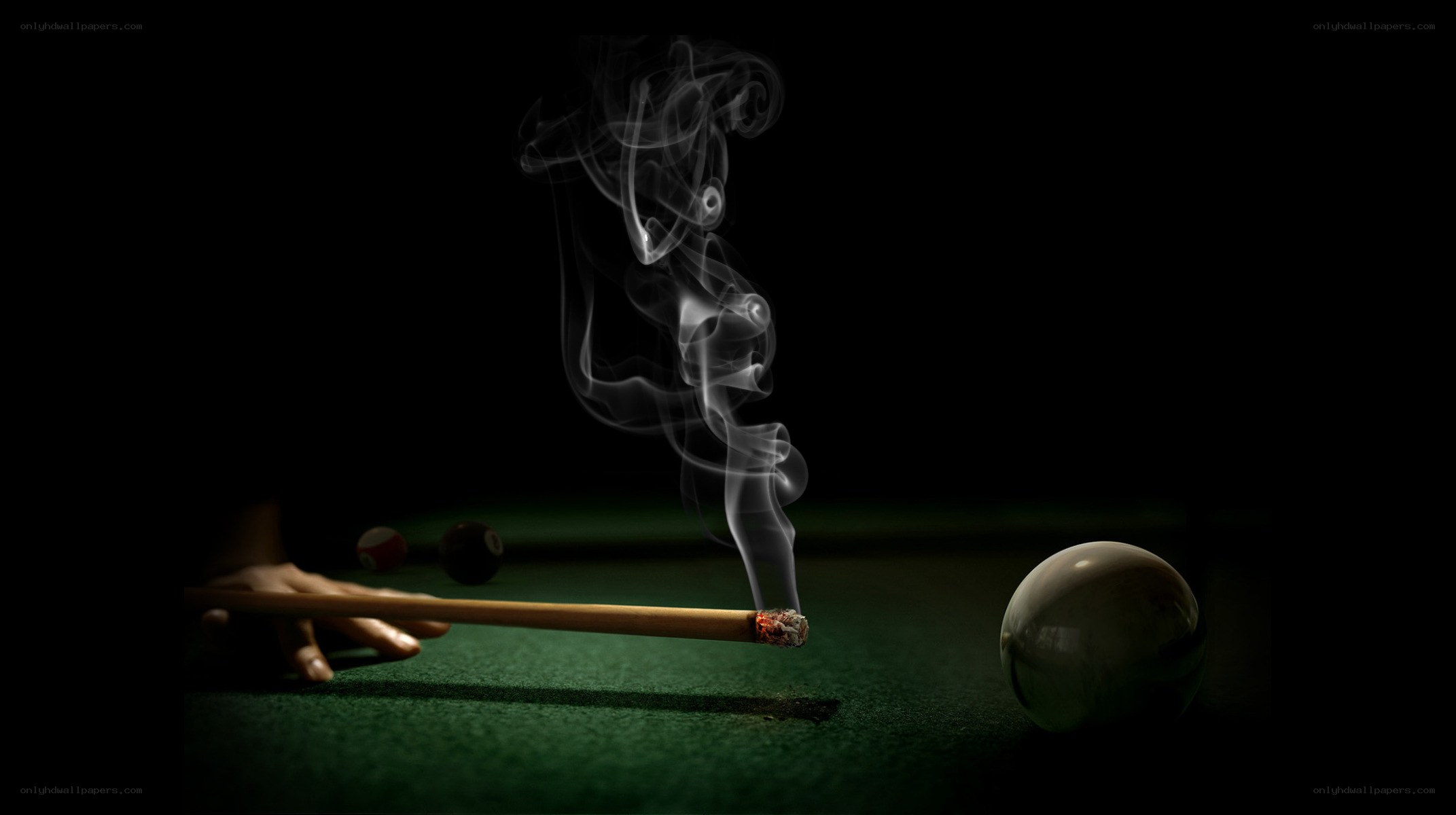 smoking pool cue on green table