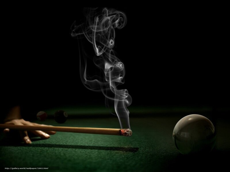 smoking pool cue on green table