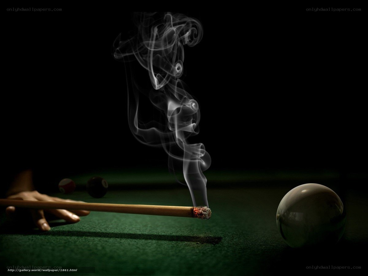 smoking pool cue on green table