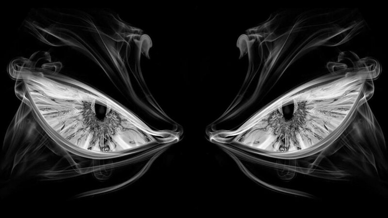 smoky eyes on black background