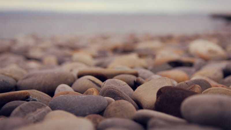 Smooth Pebbles on Beach — Gray, Calm, Morning