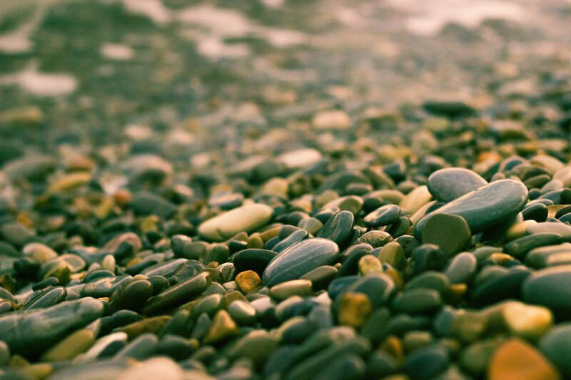 Smooth Pebbles on Beach — Green