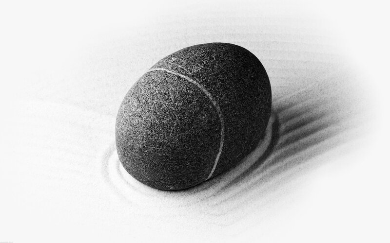smooth stone in sand